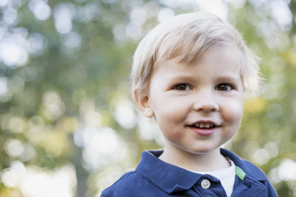 Portrait of cute 2 year old boy with brown eyes