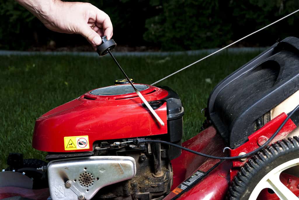 Checking the oil on a Lawn mower