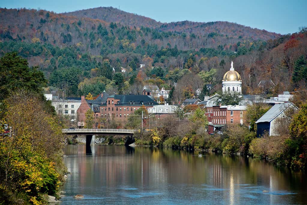 Vermont State Capitol on the Winooski River in autumn
