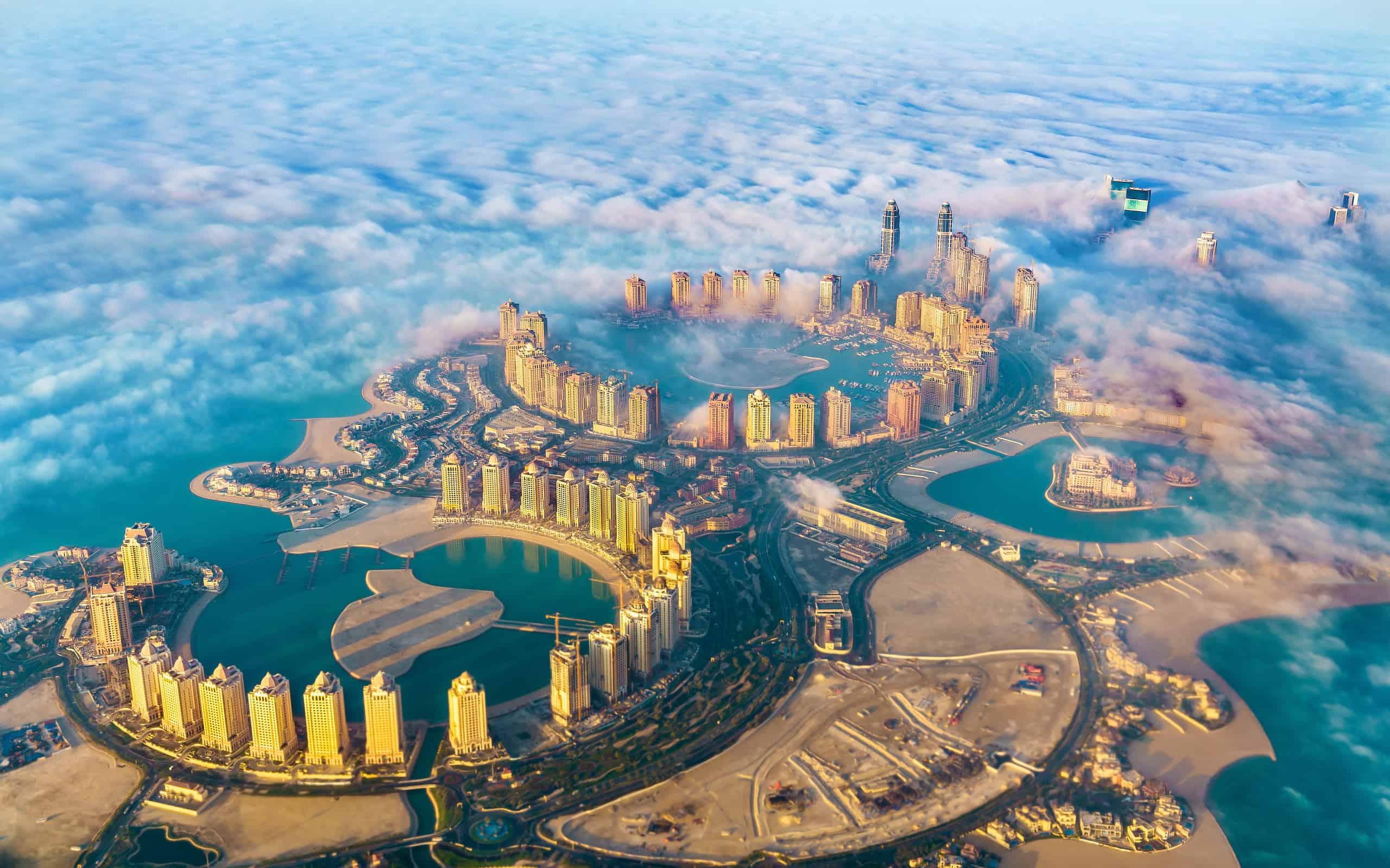 Aerial view of the Pearl-Qatar island in Doha through the morning fog - Qatar, the Persian Gulf