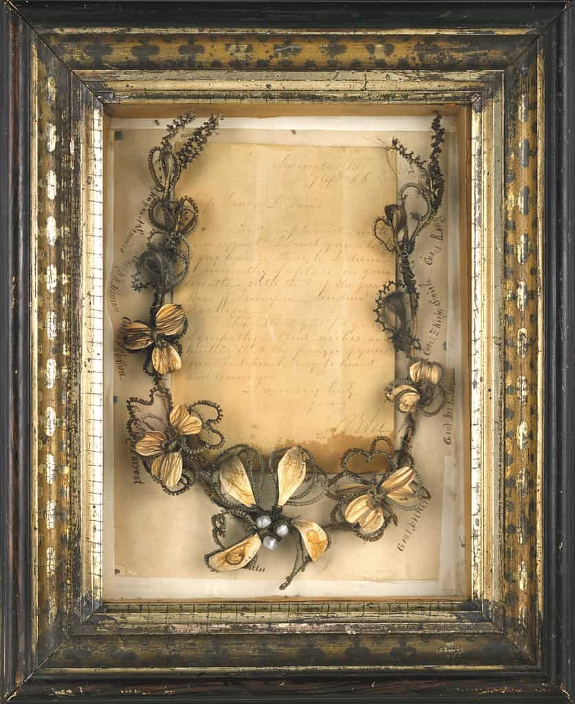 Shadow box framed hair wreath incorporating locks of hair of several prominent Southern men, mostly Confederate officers of the Civil War. 