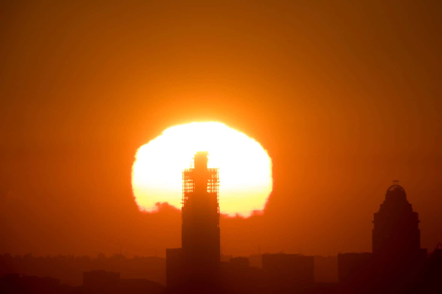 Sunrise behind The Leonardo Building while still under construction in Sandton, Johannesburg in South Africa 