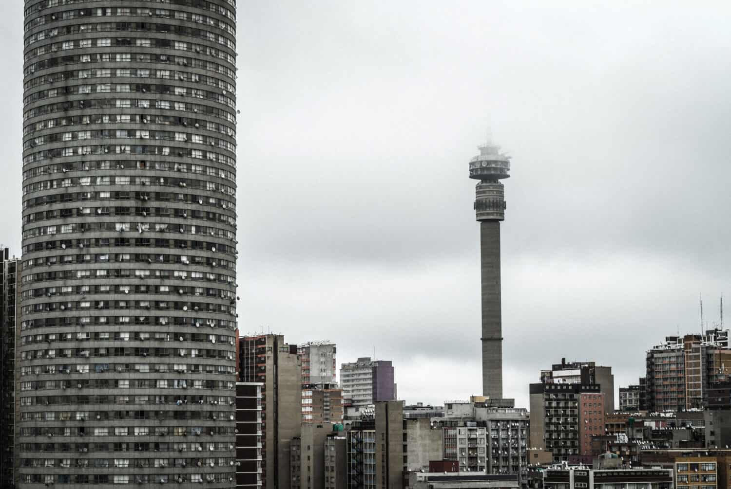 Johannesburg, South Africa city skyline on an overcast morning with Ponte and Hillbrow Tower.