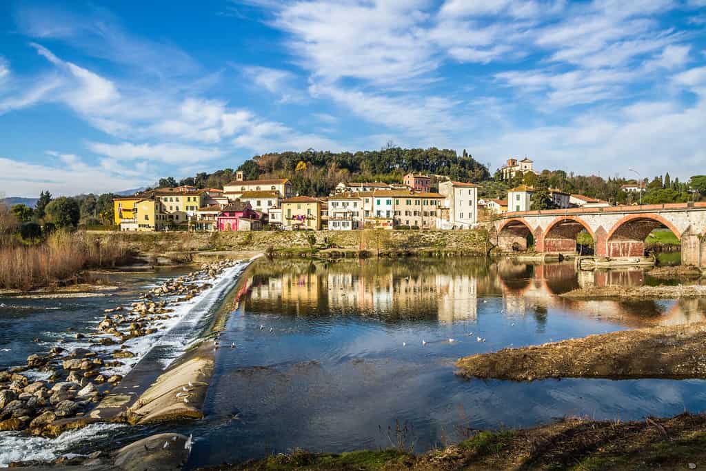 The panoramic view of the village of Monte San Quirico near Lucca, Tuscany, Italy. Isola Sant'alessio. Terrazza Guglielmo Petroni. The landscape of early spring. Pisa Mountains. The Serchio river.