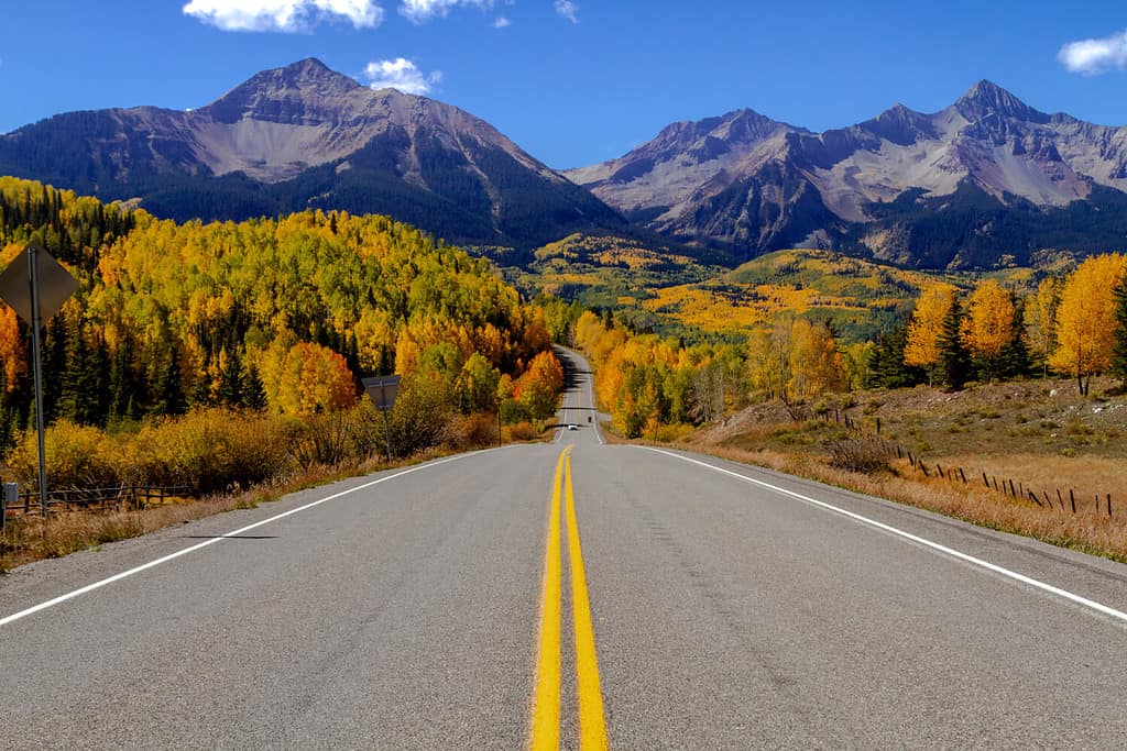 Scenic highway vista in southwest Colorado during fall color in the high country with changing aspen trees