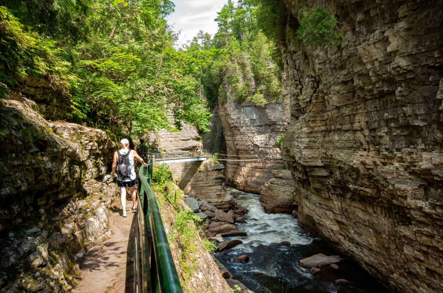 Female hiker on a trail at AuSable Chasm