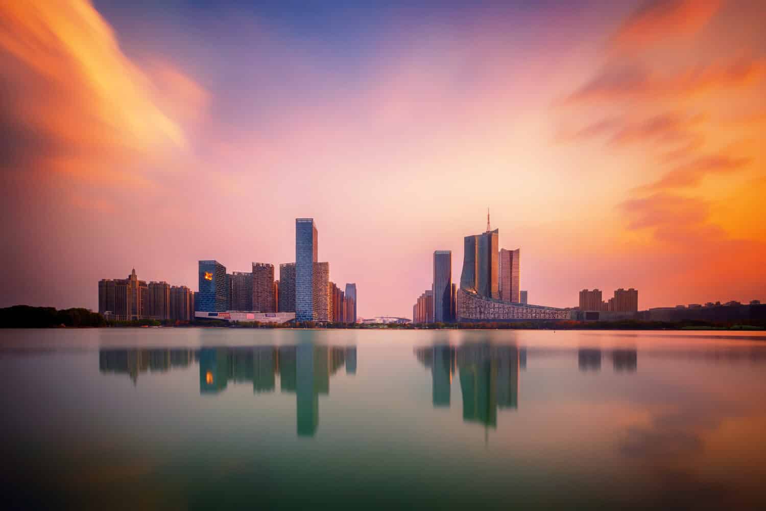 sunset over Swan Lake financial business district, Hefei city, Anhui province, China