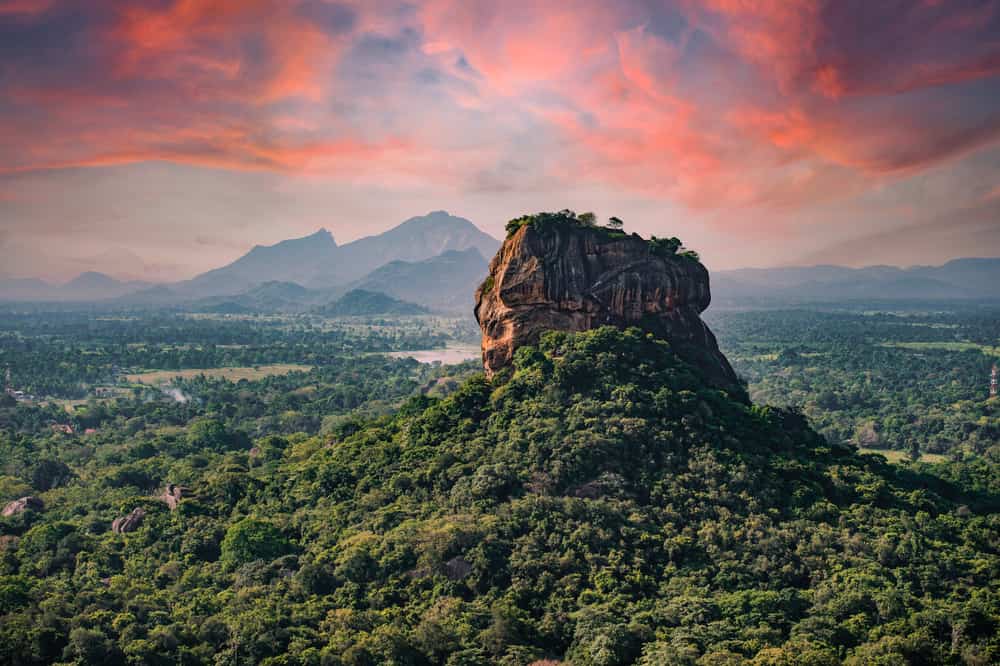 (Selective focus) Spectacular view of the Lion rock surrounded by green rich vegetation. Picture taken from Pidurangala Rock in Sigiriya, Sri Lanka.