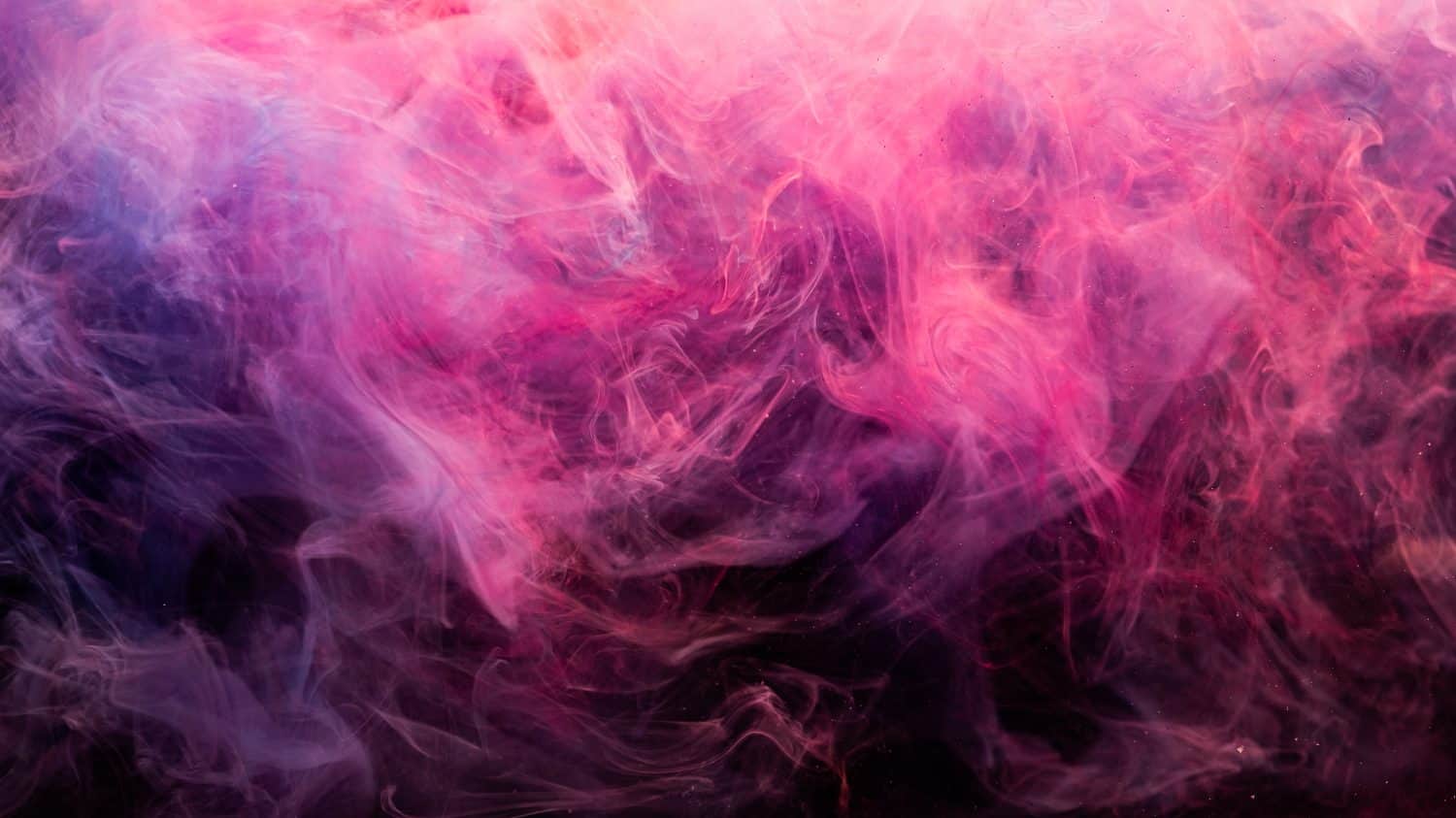 Neon smoke. Colorful abstract background. Paint in water splash. Spiritual aura. Glowing bright magenta pink purple steam blend on dark.