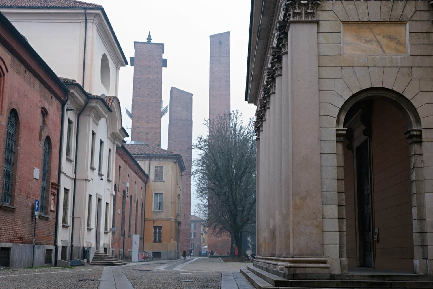 Medieval brick towers in front of the university building in Pavia. Northern Italy