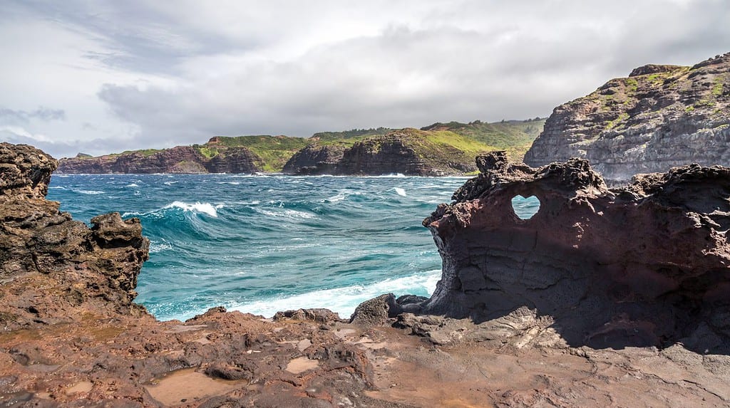 Nakalele point landscape with heart shaped hole on the island of Maui, Hawaii.