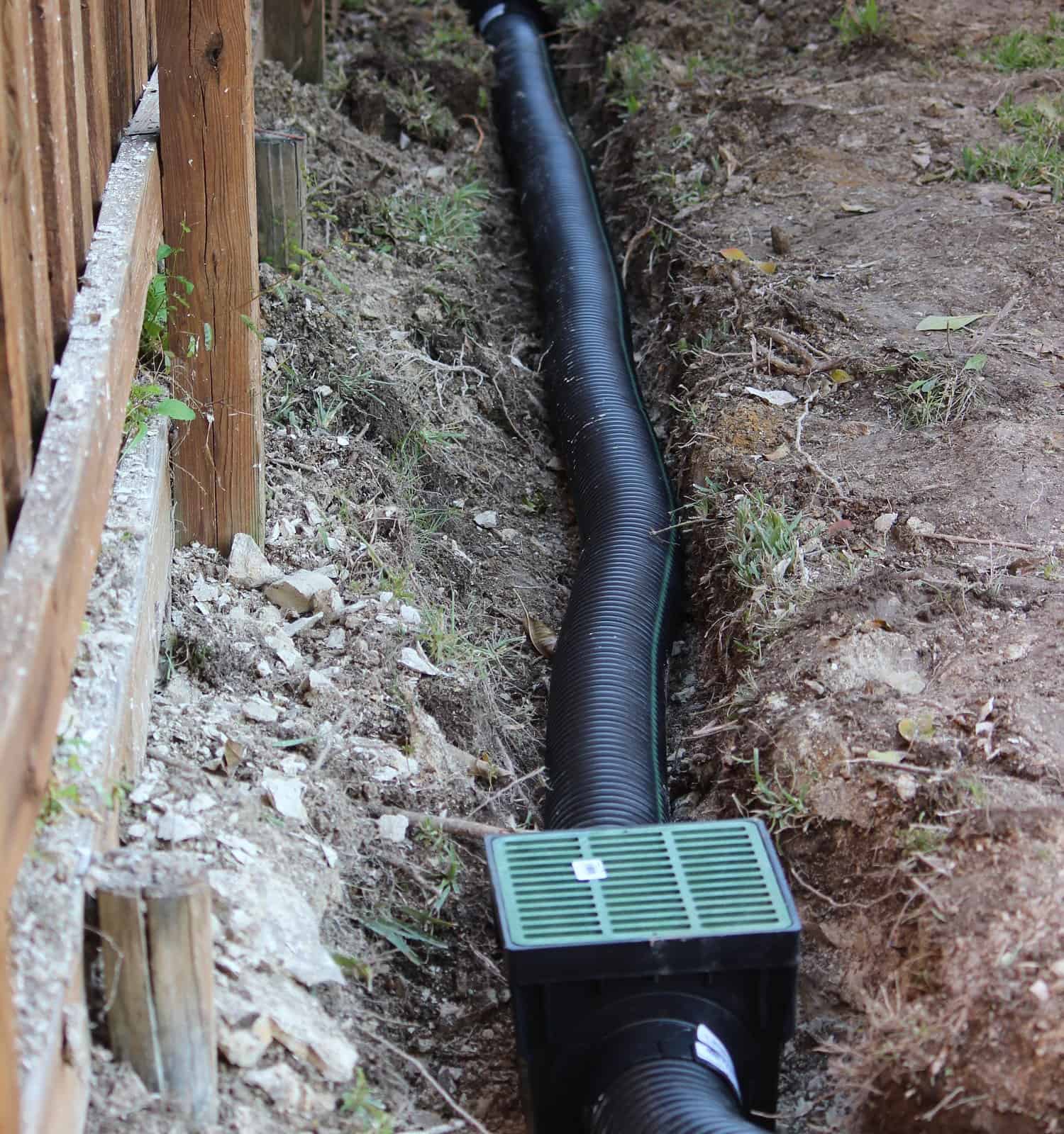 Building an Underground French Drain System after Digging a trench system to keep water away from home's foundation. Protecting Home’s Foundation from Water Damage
