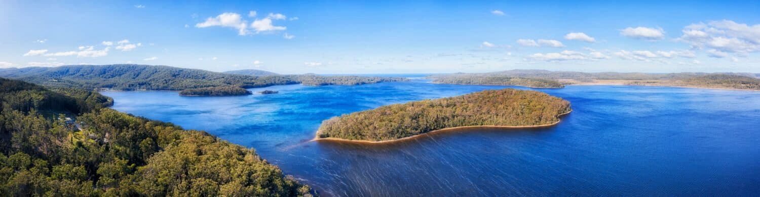 Wide aerial panorama over Myall lake in National park of Australia - popular holiday destination for camping and fishing on Pacific coast.
