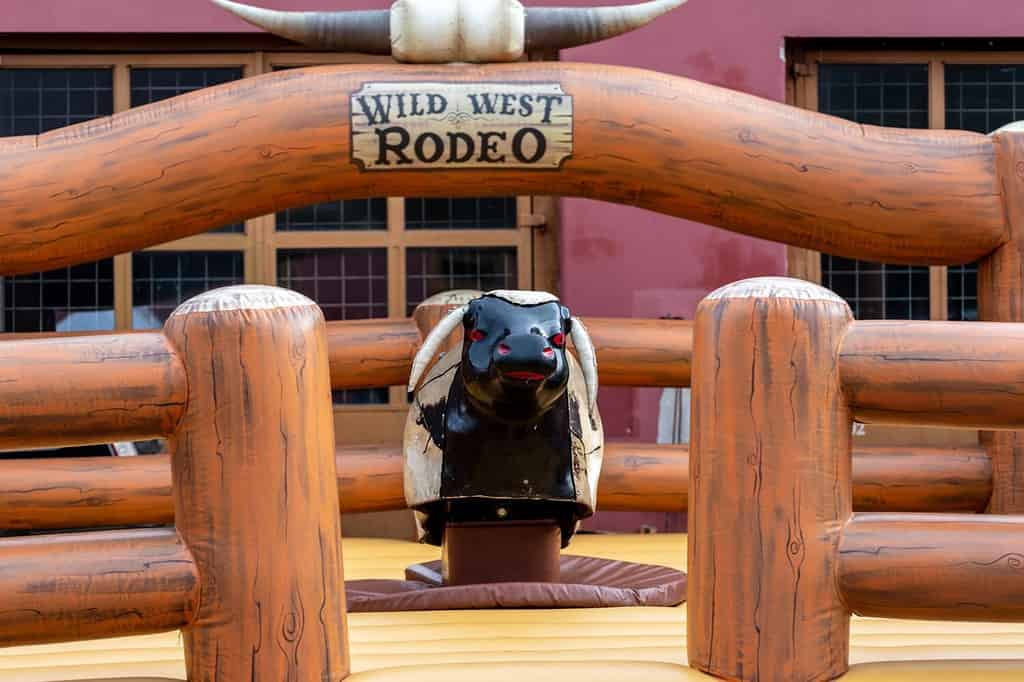 Large rodeo mechanical Bull Riding machine made from wood.