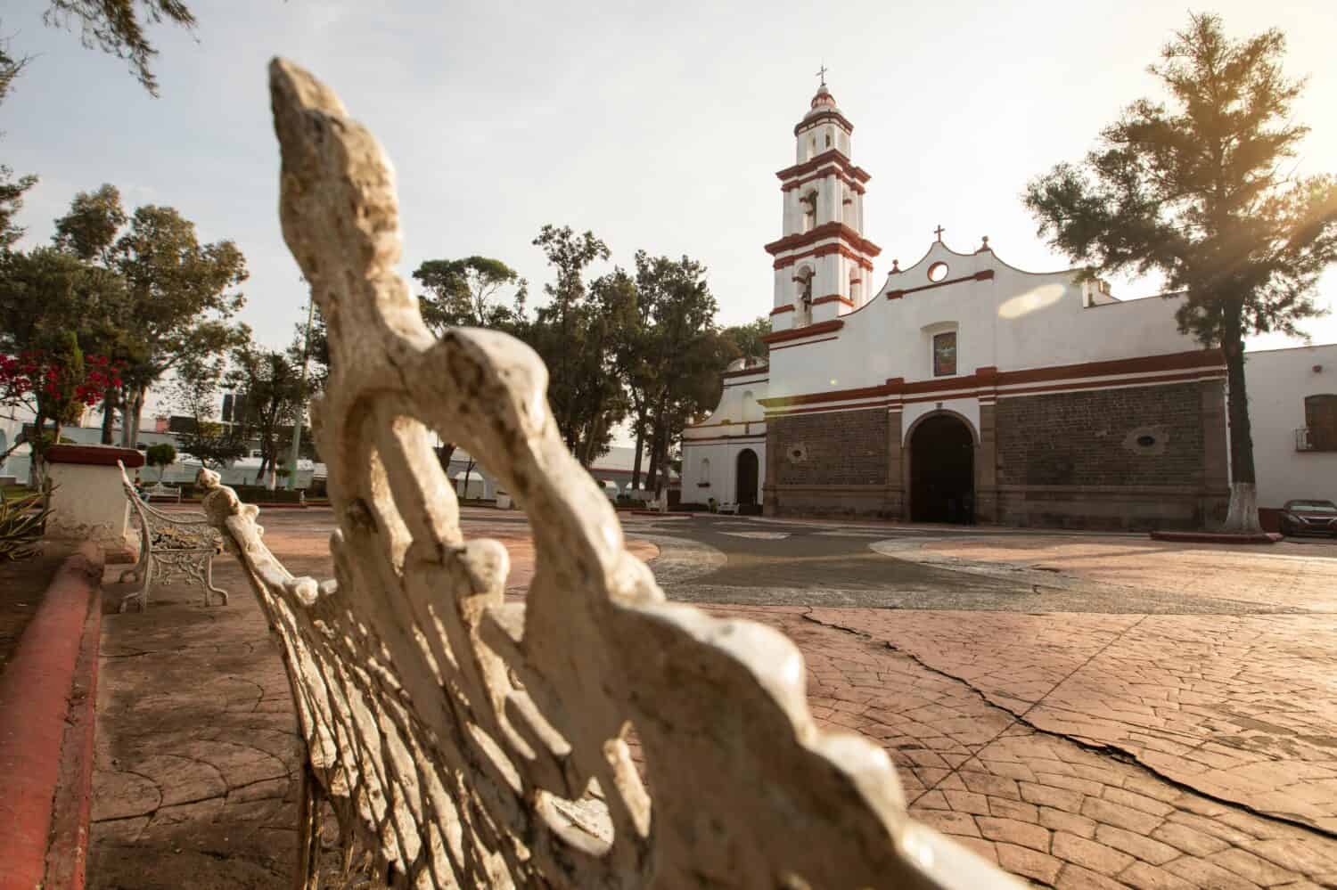 Ecatepec de Morelos, Mexico - November 19, 2022: Morning light shines on a historic church in central Ecatepec.