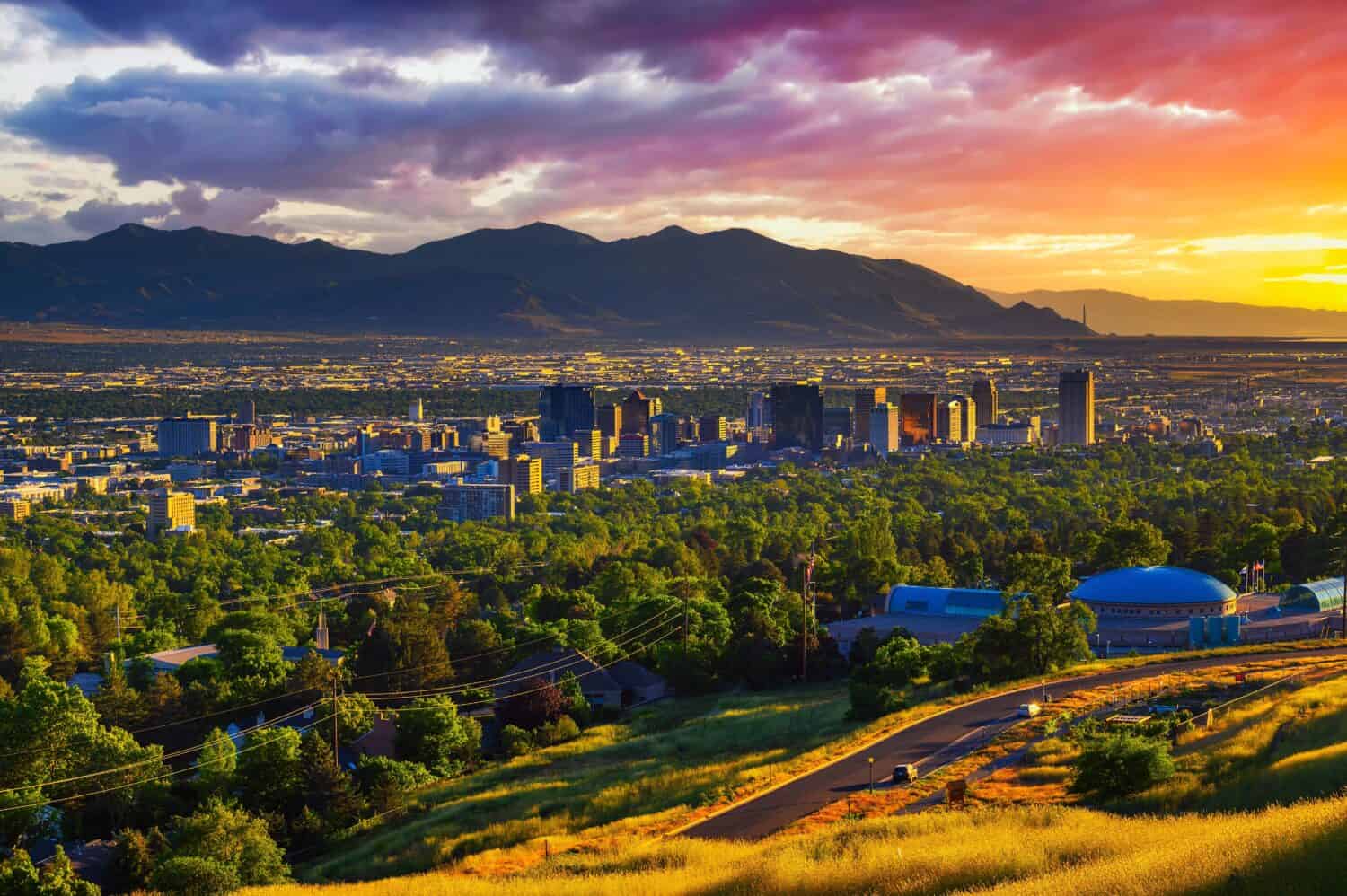 Salt Lake City skyline at sunset with Wasatch Mountains in the background, Utah, USA.