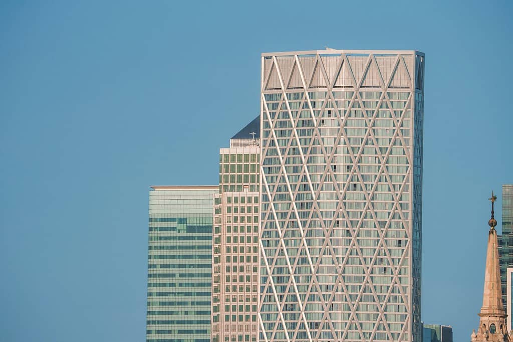 Modern skyscrapers in city. Financial office building with blue sky in background. Glass windows on modern Newfoundland tower in downtown district of London.