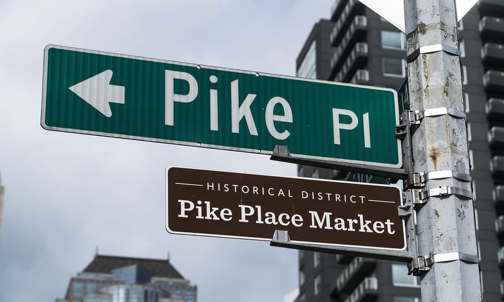 Pike Place Market street sign at at Pike Place Public Market in Seattle : home to the original Starbucks coffee shop.