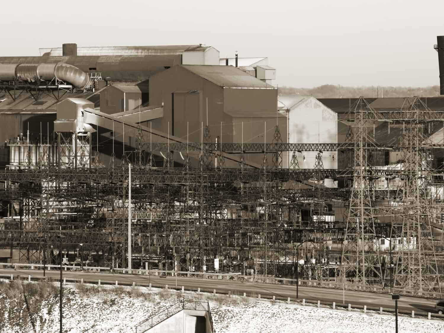Old steel mill in winter, black and white, sepia toned