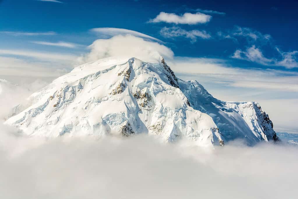 Cloudy Mount Foraker; aerial view of snowcapped peak