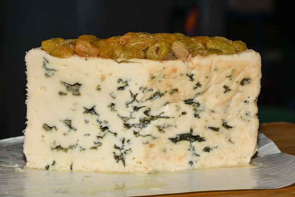 Basajo, unpasterurised sheep's milk blue cheese aged in fine Passito di Pantelleria wine, a variety of cheeses for sale at Borough Market in London, United Kingdom.