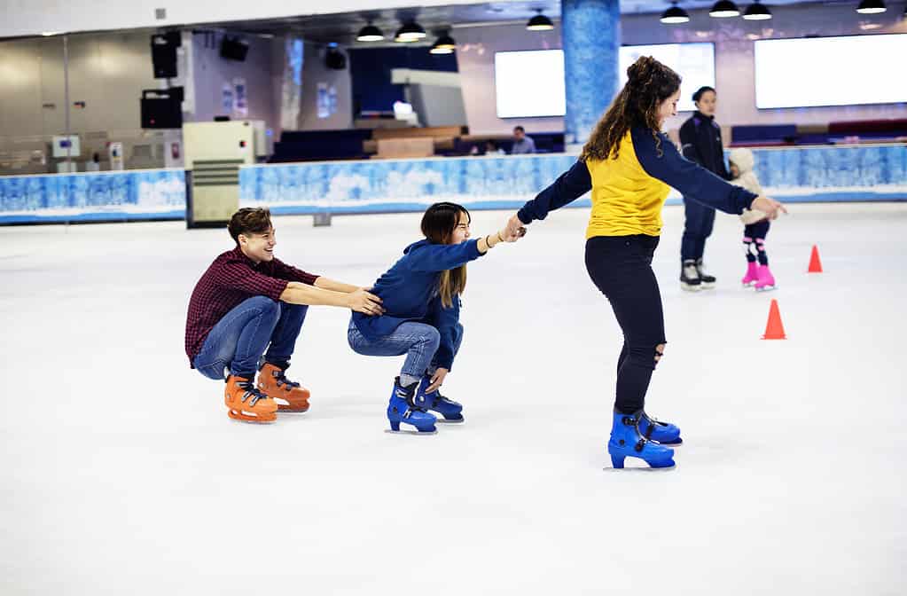 Ice-skating, Asian and Indian Ethnicities, Indoors, Friendship, Child