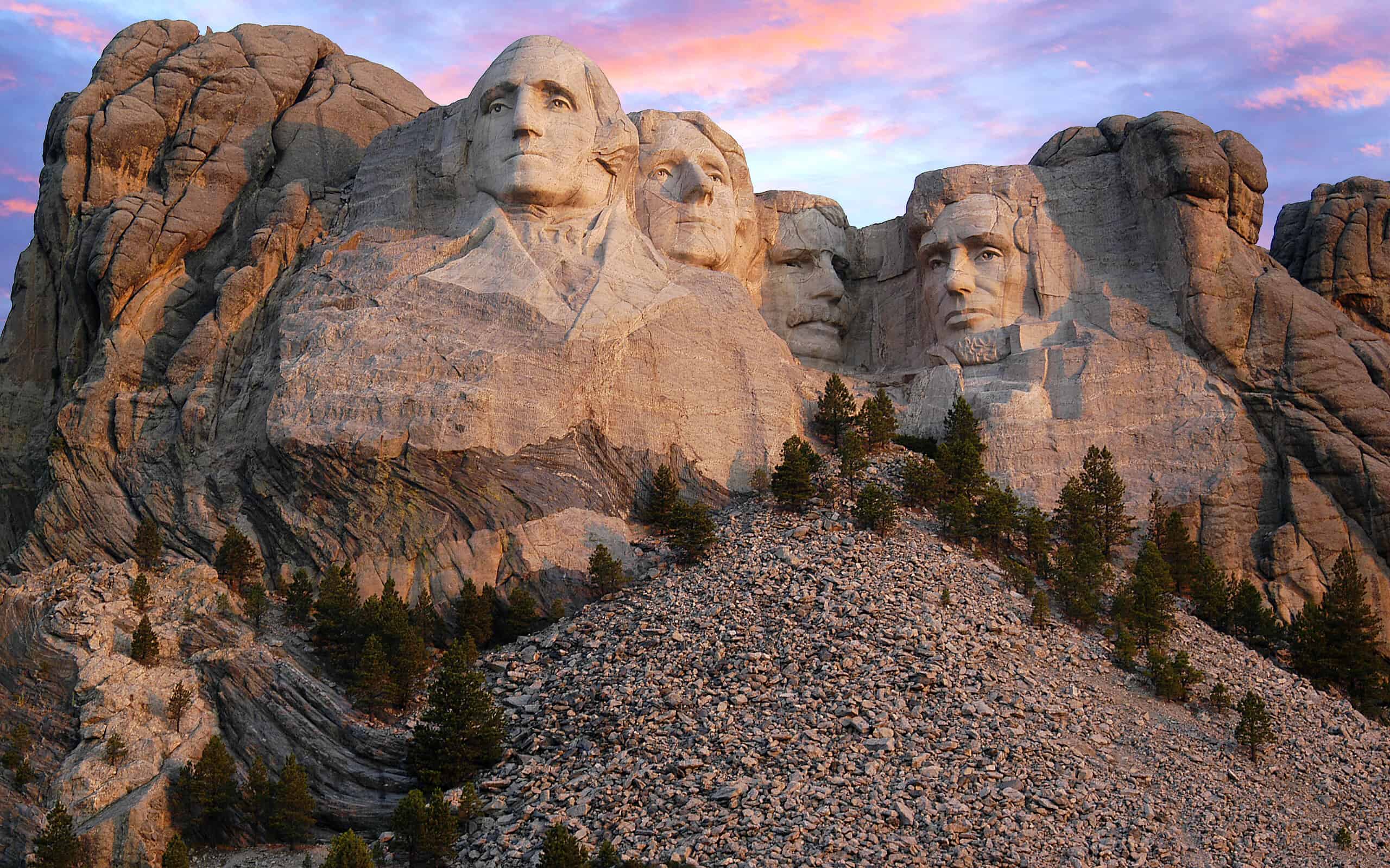 Mount Rushmore morning as the sun begins to light up the mountain range.