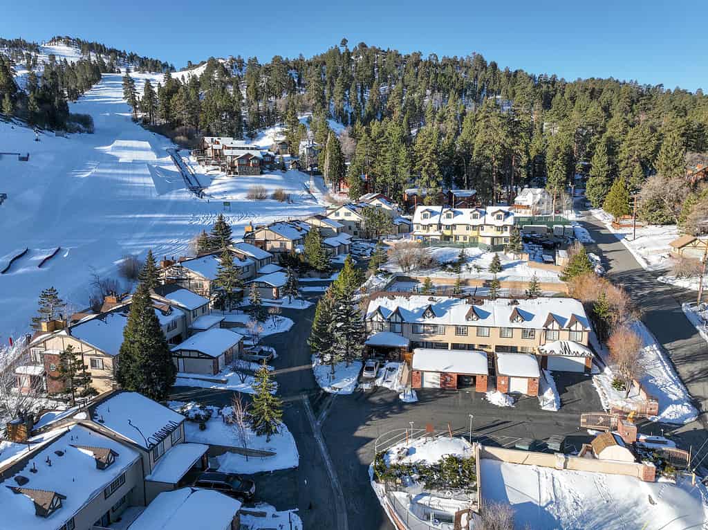 Aerial view over Big Bear Lake Village with snow, South California, USA