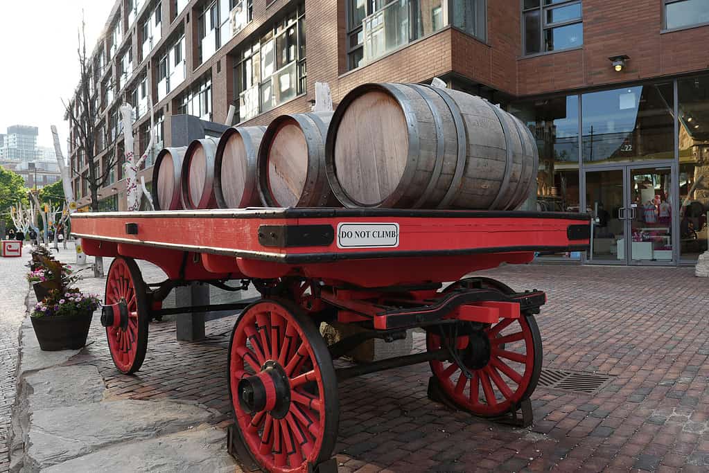Retro wooden red wagon or carriage with barrels in Distillery District in Toronto