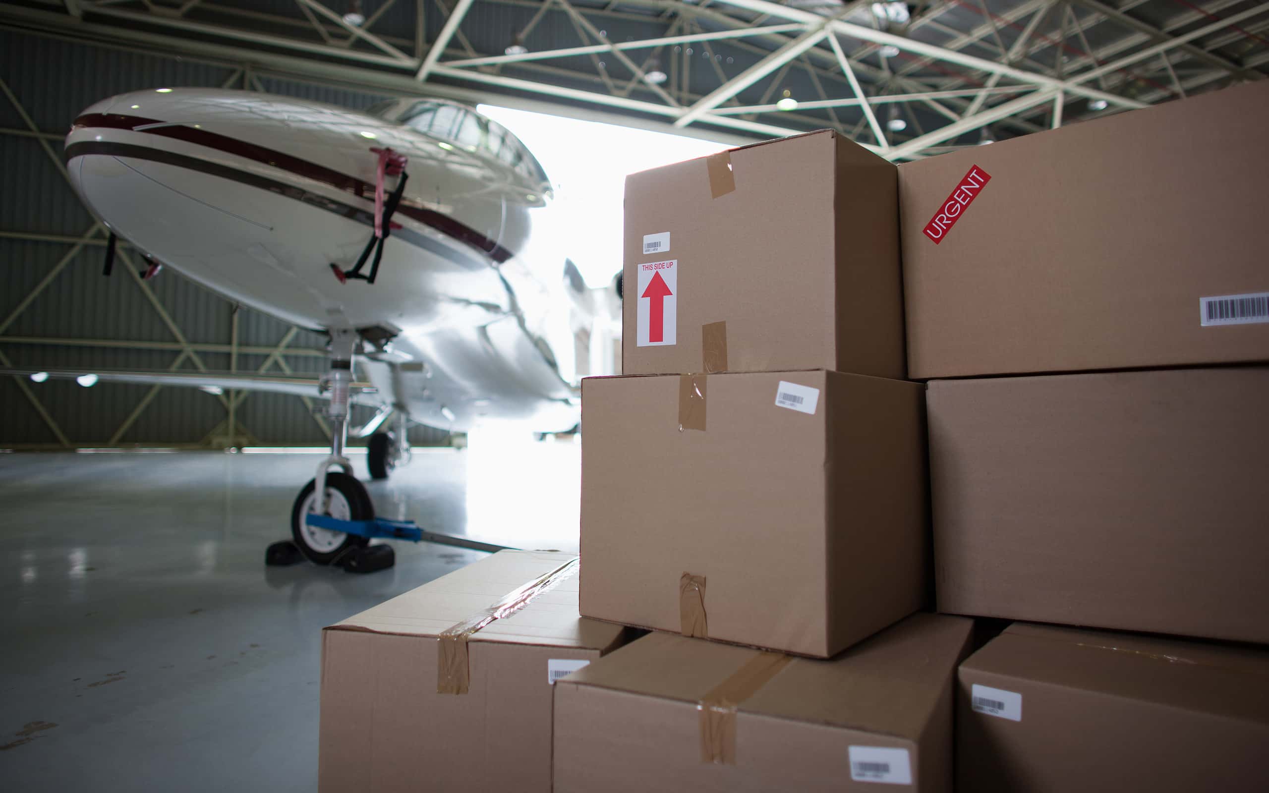 Airplane and boxes in hangar