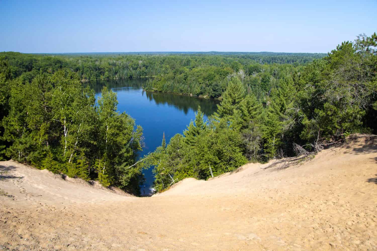 Au Sable River Wilderness Overlook. View of the Huron National Forest wilderness with the famous Au Sable River in the lush green forests of Michigan.