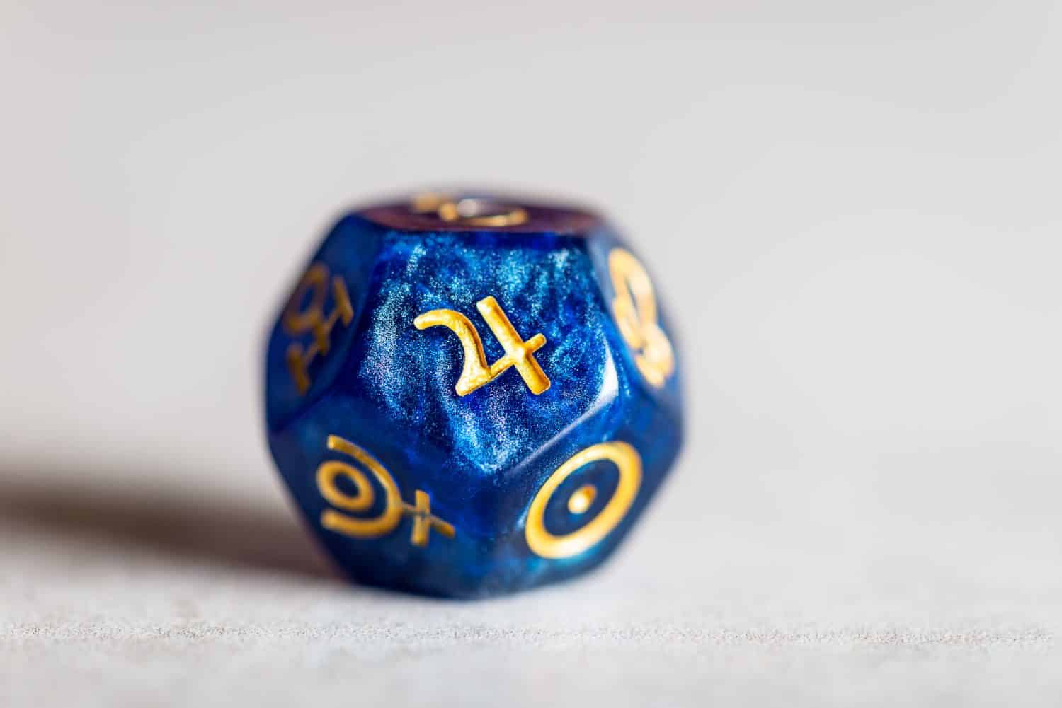 Astrology Dice with symbol of the planet Jupiter on grey background