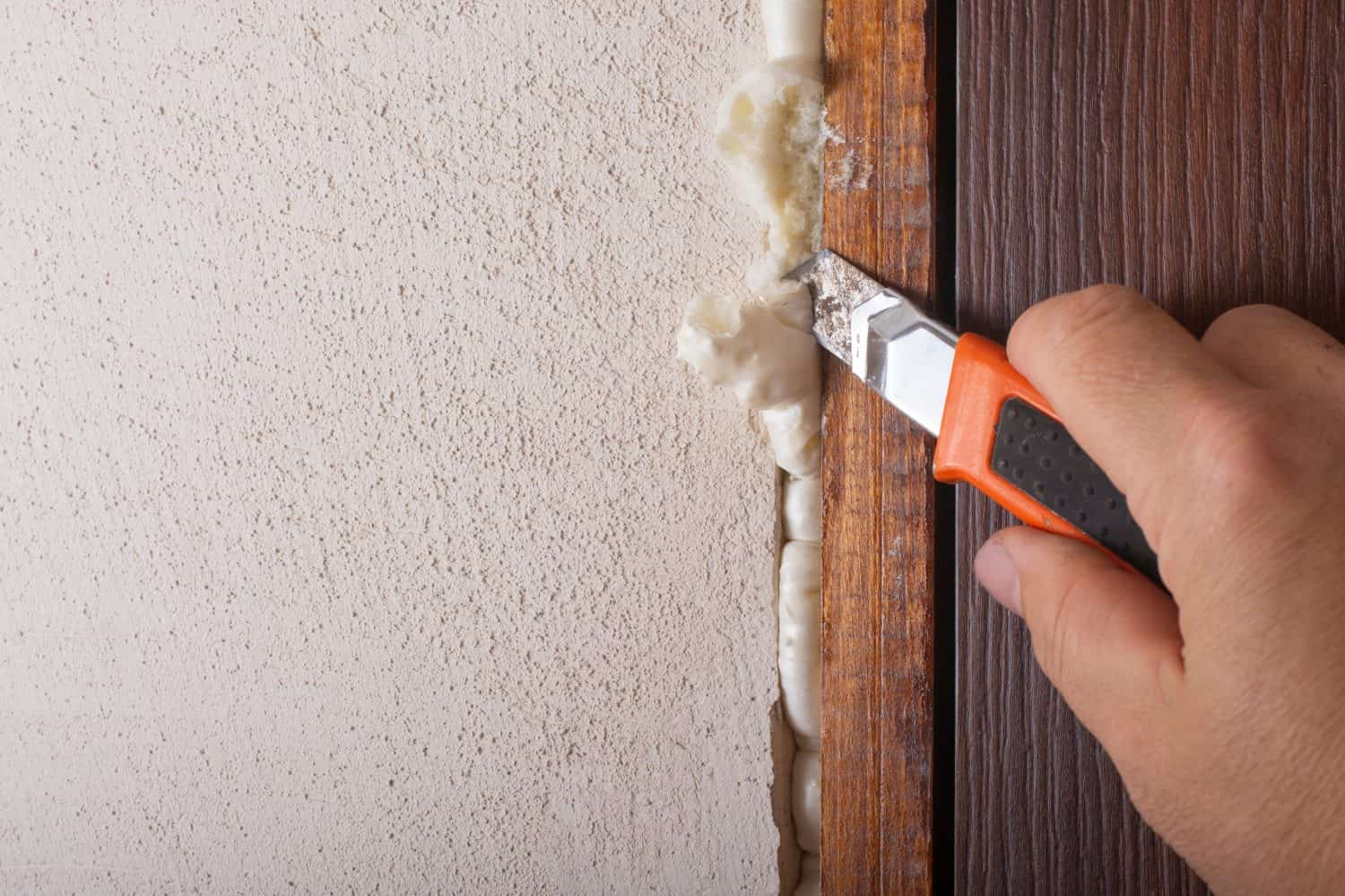 Remove excess polyurethane foam with a knife.