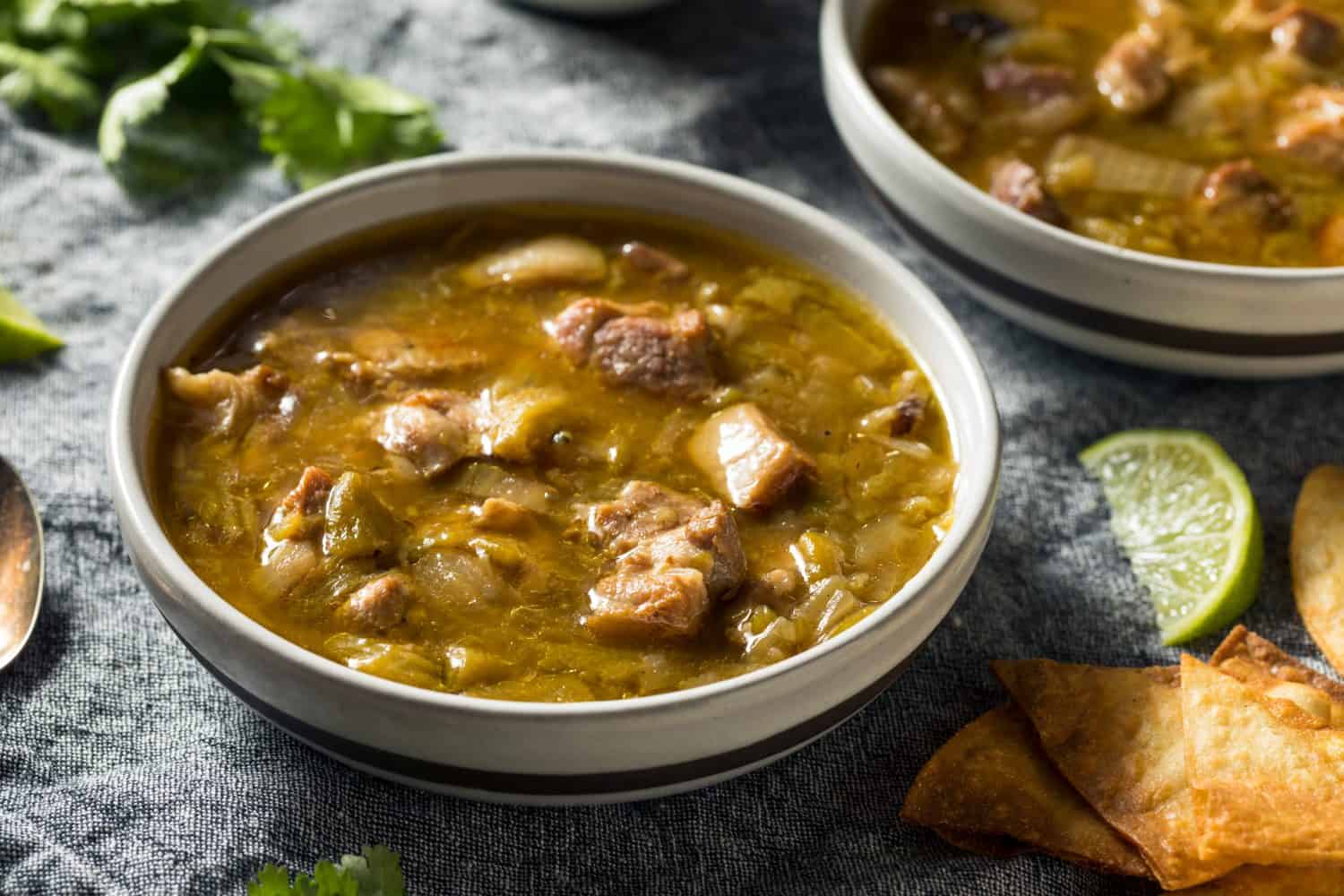 Homemade Colorado Pork Green Chili Soup with Chips and Lime