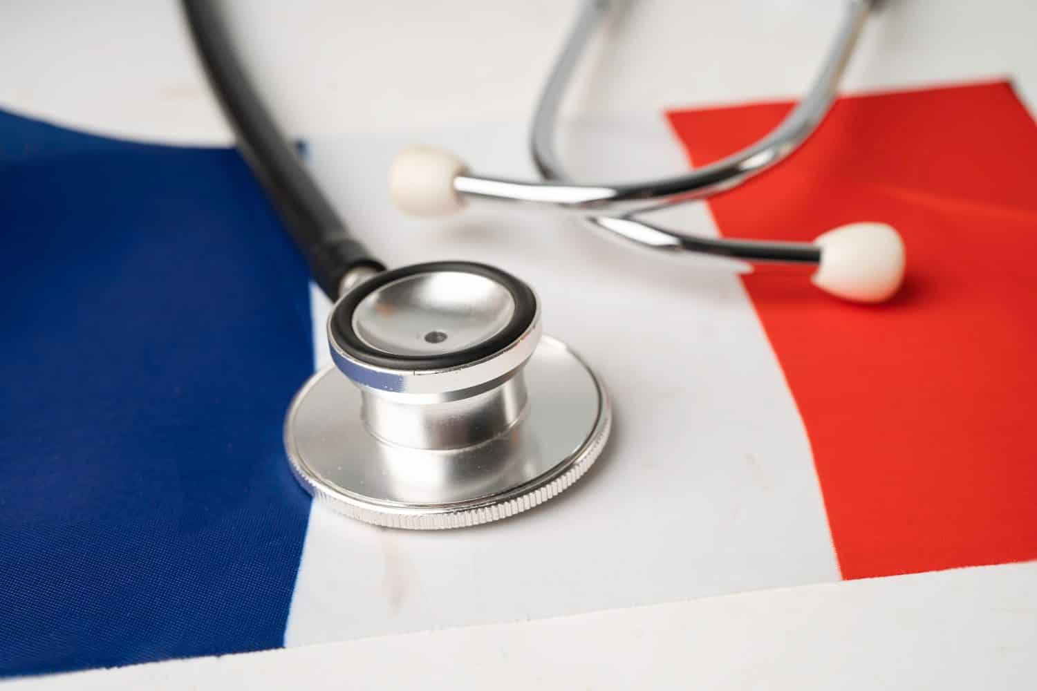 Black stethoscope on France flag background, Business and finance concept.