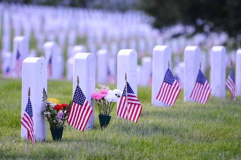 Arlington National Cemetery with a flag next to each headstone during Memorial day - Washington DC United States
