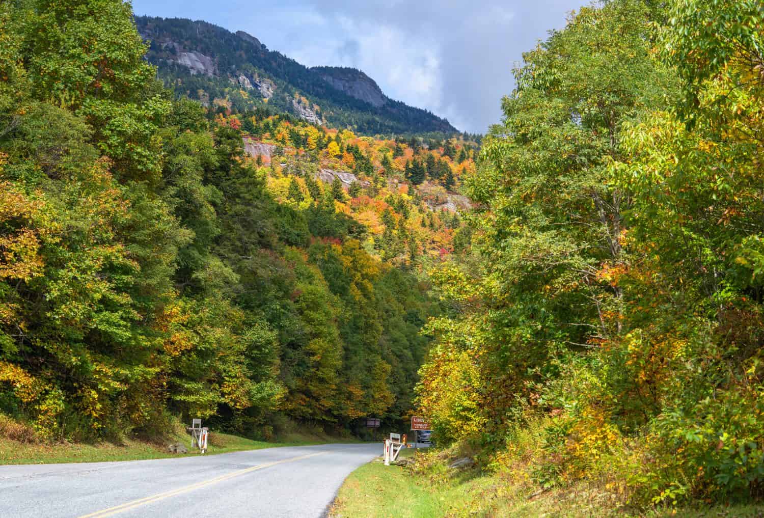 Blue Ridge Parkway autumn Landscape. North Carolina Highlands and Grandfather Mountain. Road winding in autumn mountains. Near Asheville, North Carolina. USA. Copy space.
