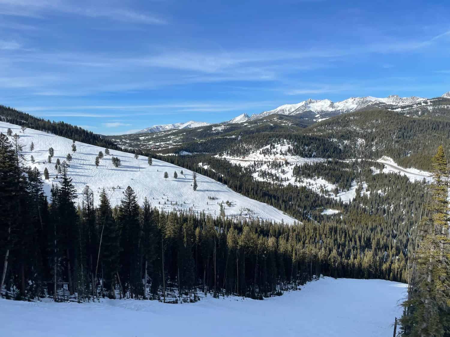 Scenic view of the snow covered peaks and slopes at Big Sky Ski Resort in Montana on a sunny winter day