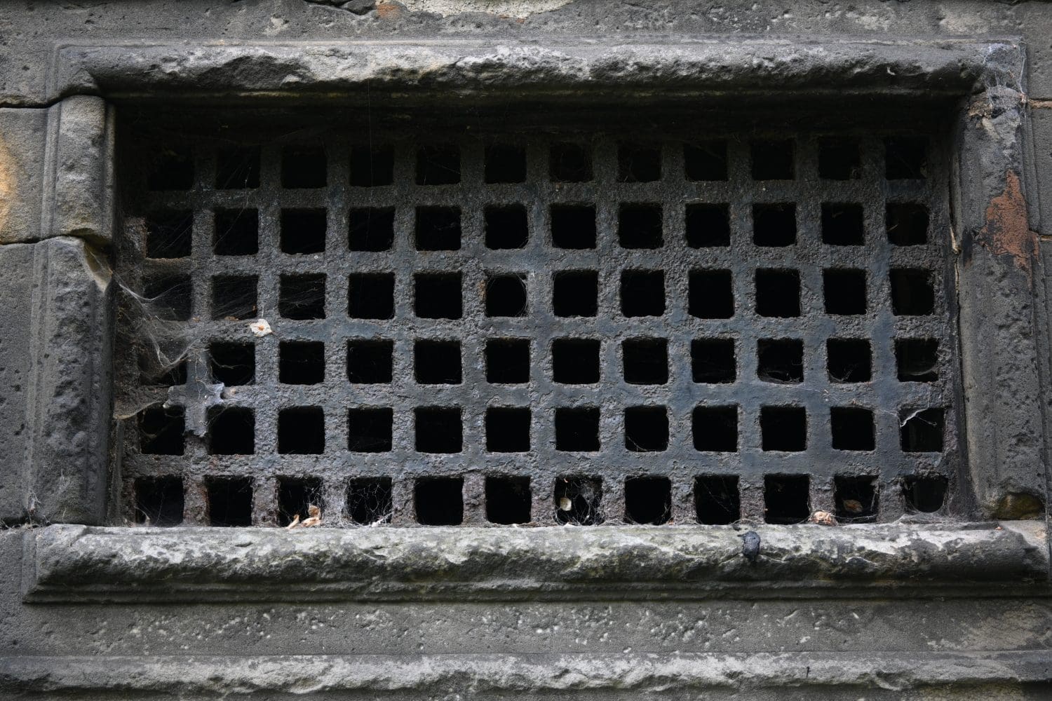 Close up of rusting ancient grille in vault in Greyfriars Cemetery in Edinburgh, Scotland