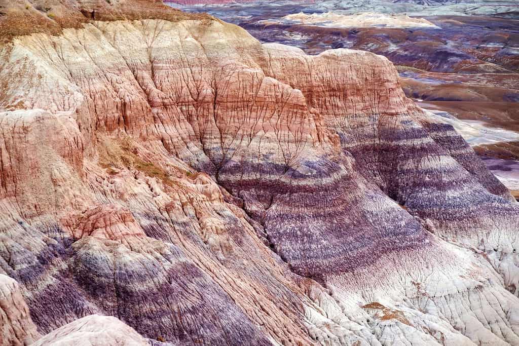 Striped purple sandstone formations of Blue Mesa badlands in Petrified Forest National Park, Arizona, USA. Exploring the American Southwest.