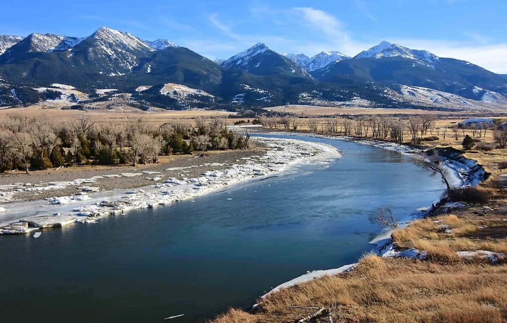 scenic winter landscape on a sunny day at mallard's rest fishing access along the paradise valley scenic loop of the yellowstone river and gallatin range, south of livingston, montana