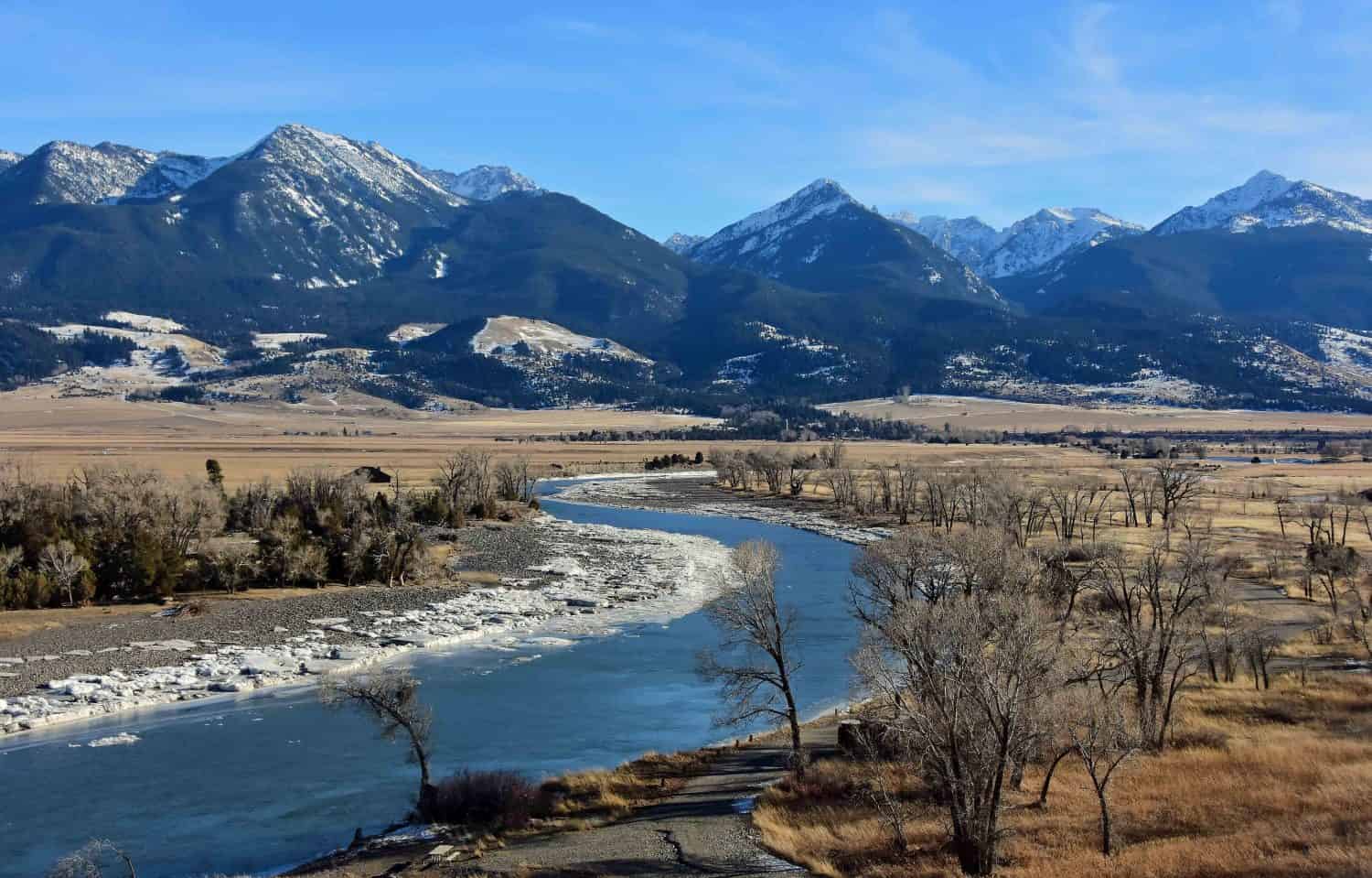 scenic winter landscape on a sunny day  at mallard's rest fishing access along the paradise valley scenic loop of the yellowstone river and gallatin range, south of livingston, montana