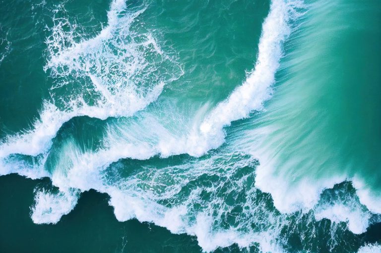 Spectacular aerial top view background photo of ocean sea water white wave splashing in the deep sea. Drone photo backdrop of sea wave in bird eye waves.