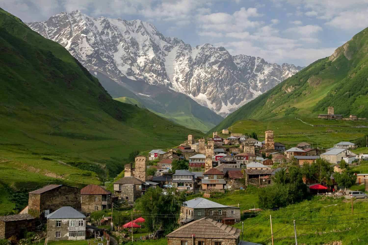 View of the alpine village of Ushguli against the backdrop of Mount Shkhara, Georgia, Svaneti