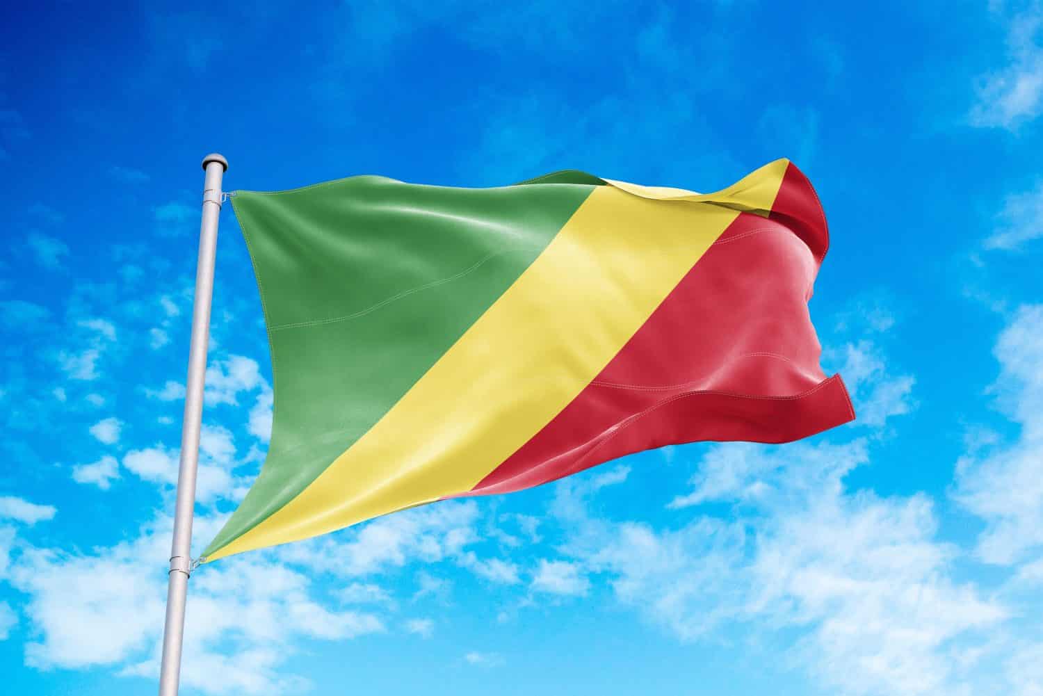 Congo Republic flag waving in the wind, blue sky background, Countries that End in O