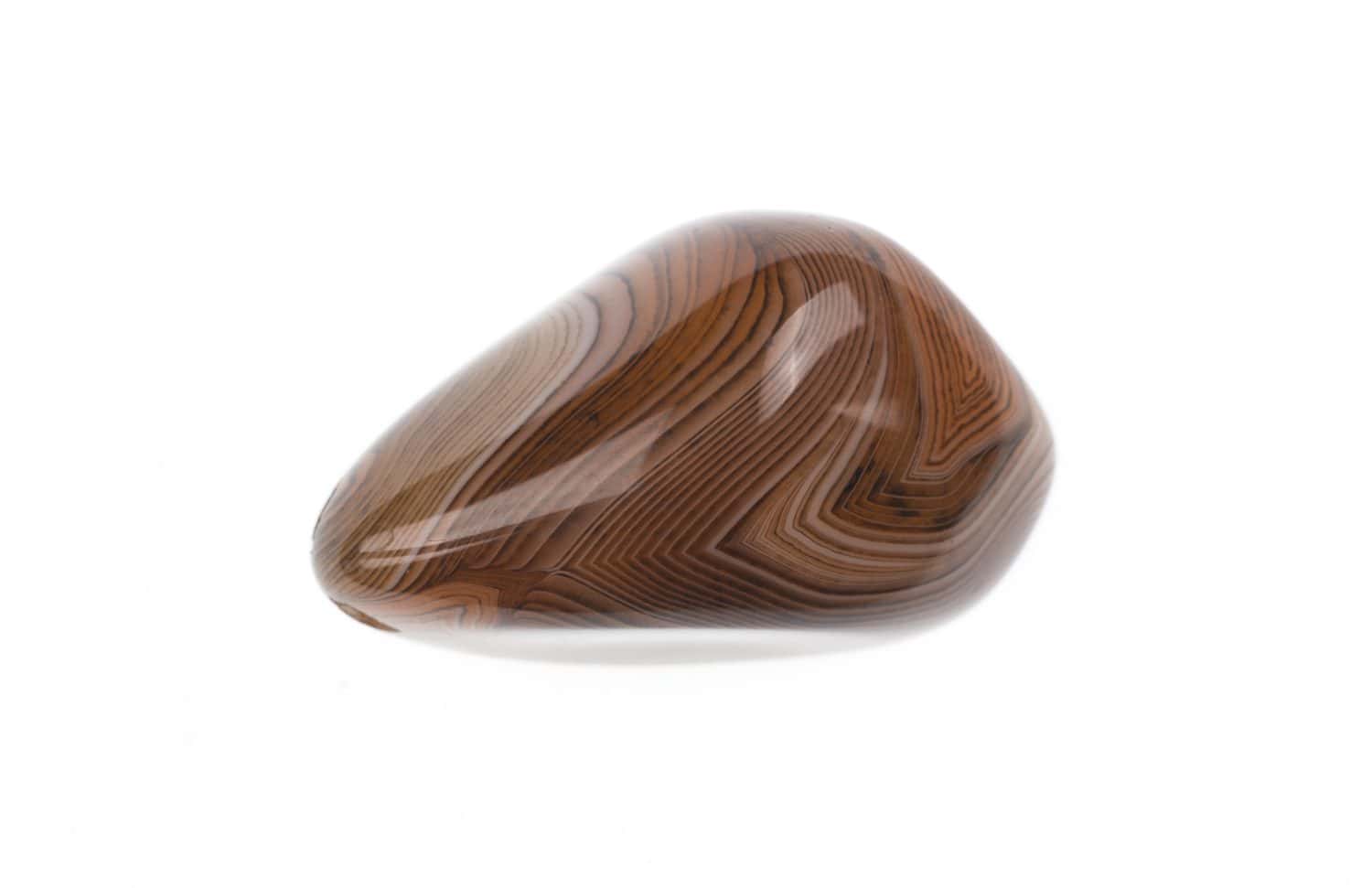 polished brown agate stone isolated on white background
