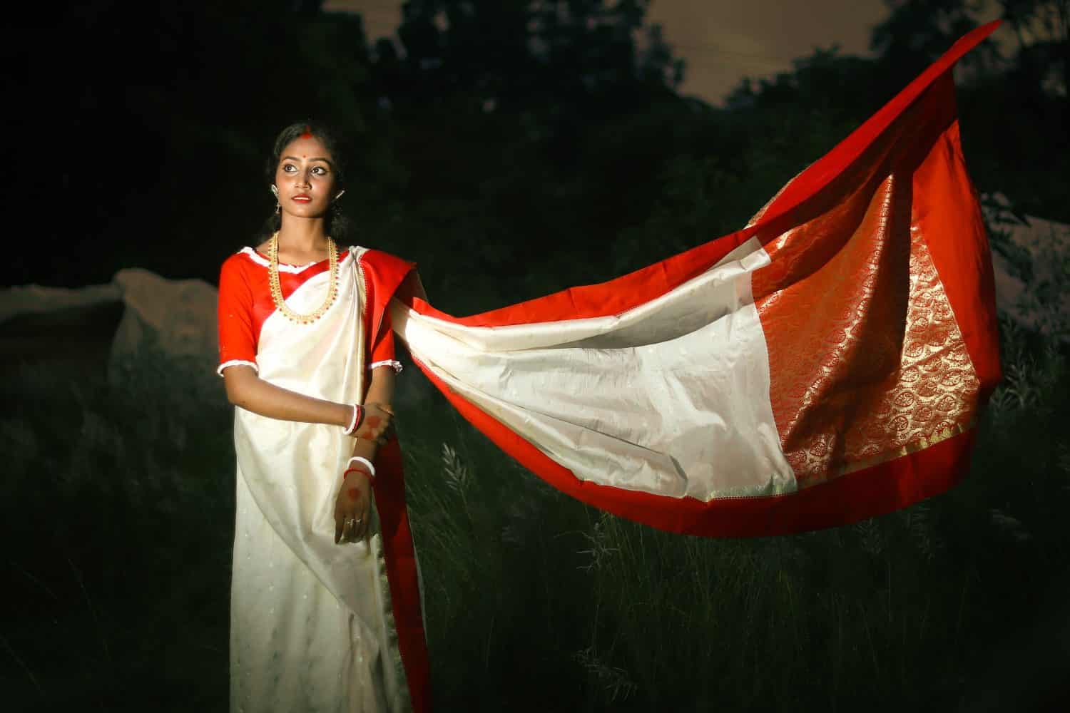 Beautiful Portrait of bangladesh Girl wearing traditional clothes with greeting gesture. Incredible Bangladesh.