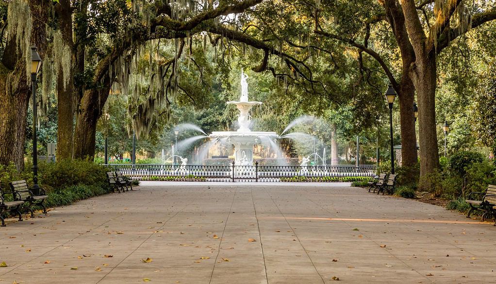 Walkway under southern oaks toward the fountain in Forsyth Park, Savannah, Georgia