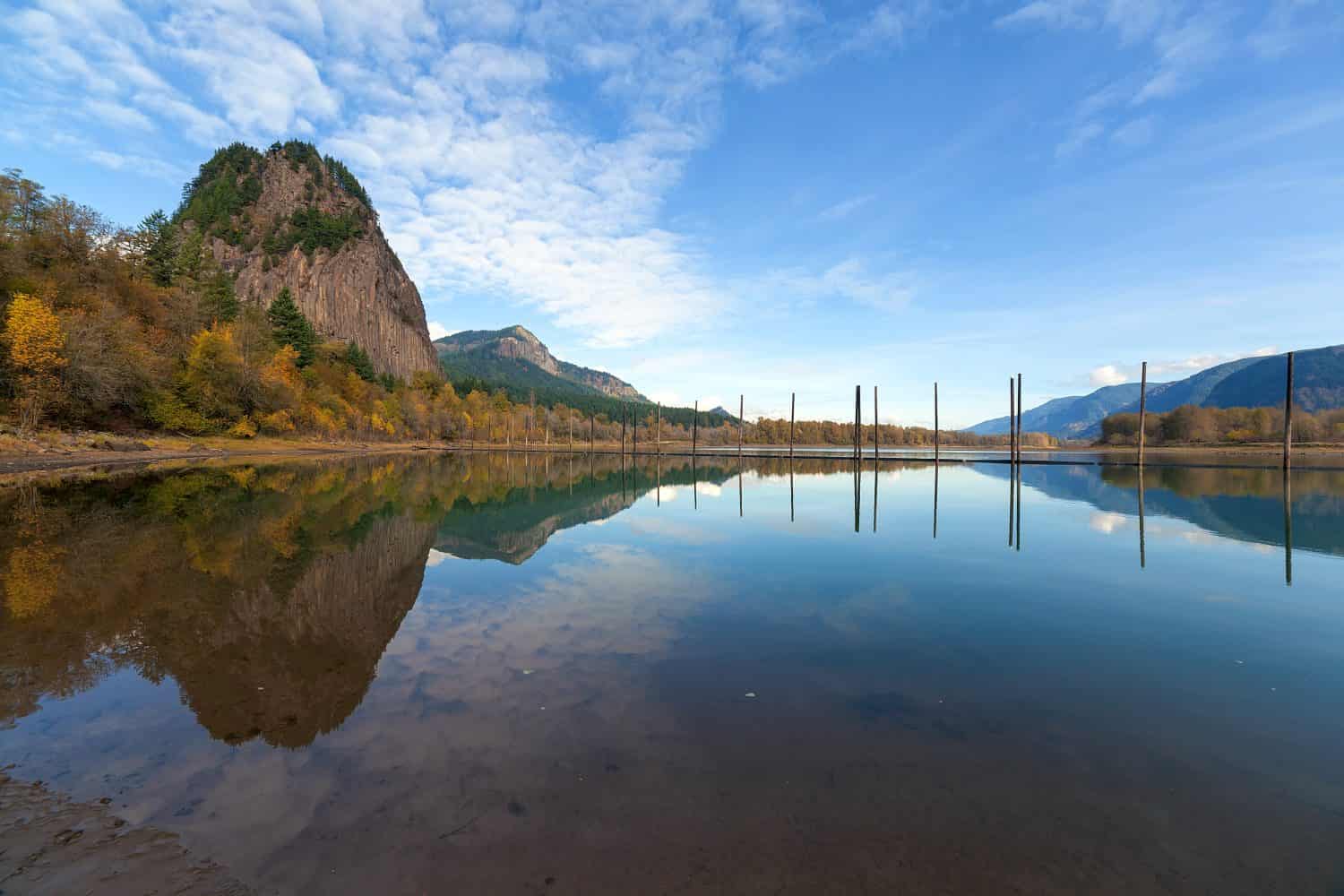 Beacon Rock State Park in Washington State Reflected in the Water of Columbia River Gorge in Fall Season