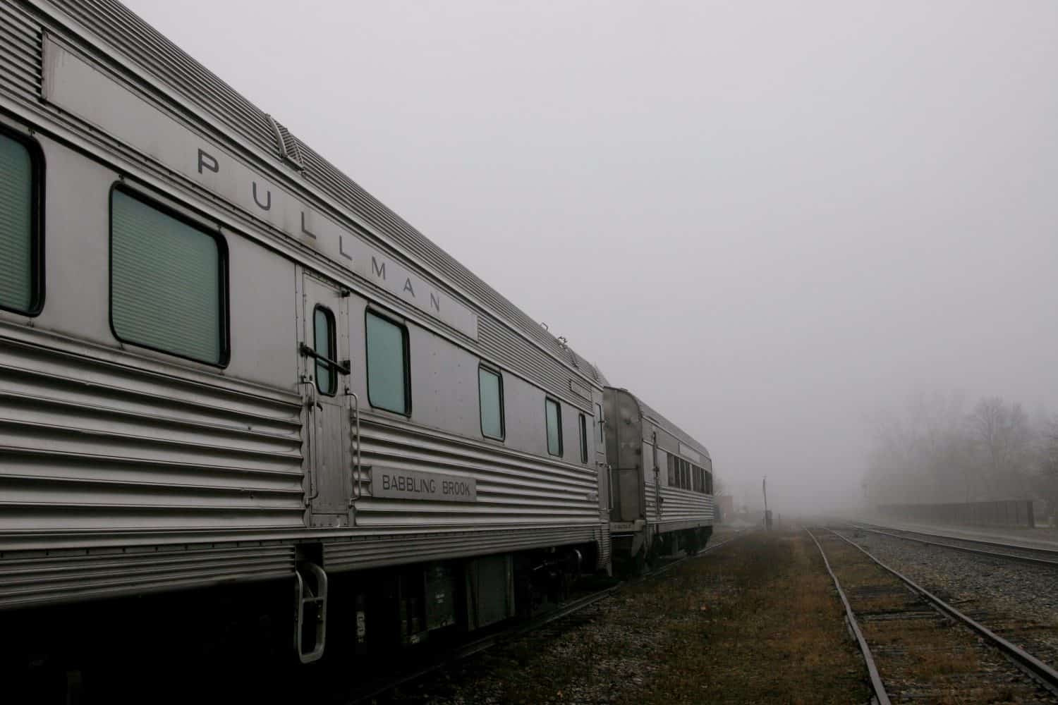 Pullman railroad sleeper cars in fog